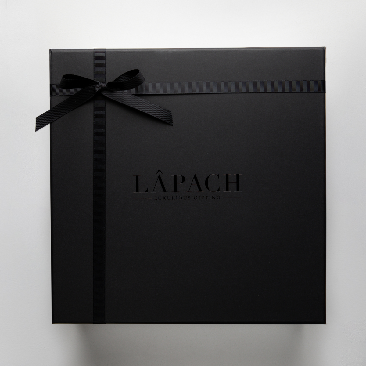 Black gift box with black ribbon