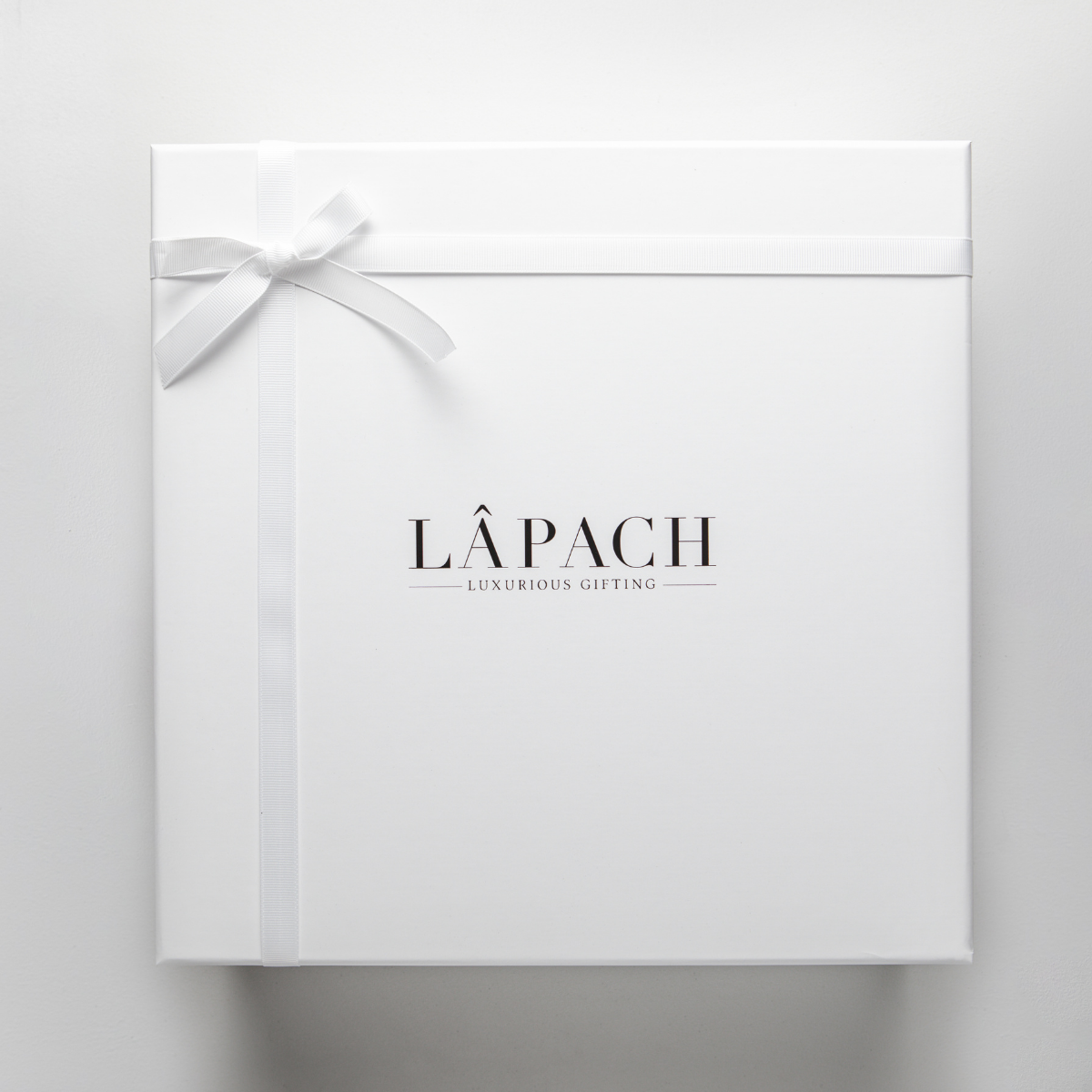 White gift box with ribbon