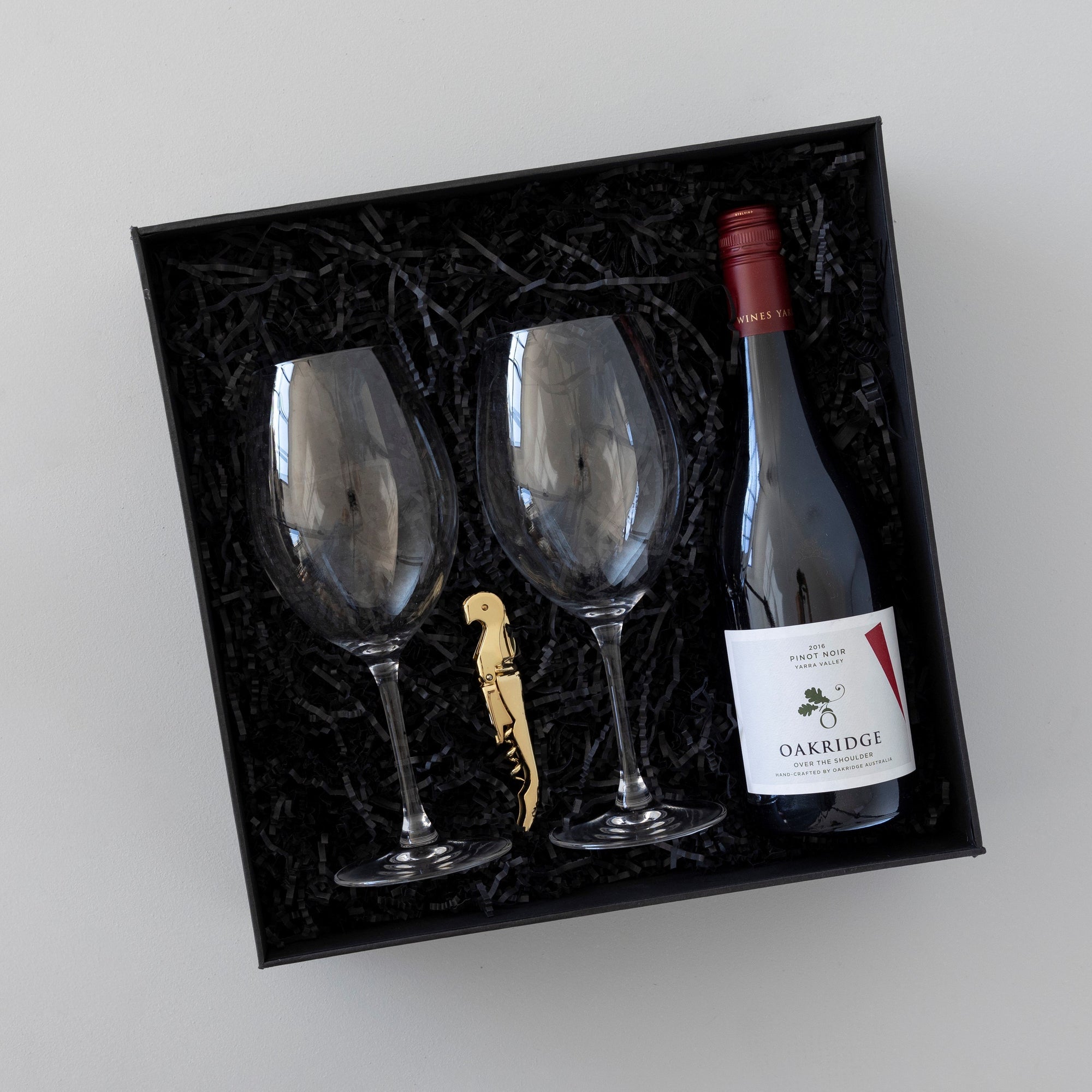 Gift box with crystal wine glasses, wine knife, bottle of red wine
