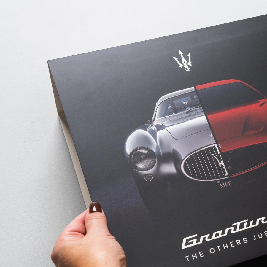A fully branded Maserati gift box and printed sleeve produced by LÂPACH for a Gran Turismo drive day.